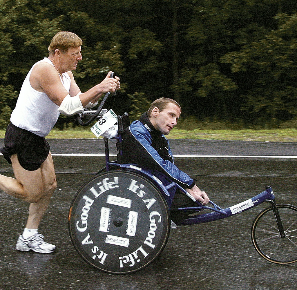 Dick Hoyt pushes his son Rick off from the starting line at the Peoples Beach to Beacon 10K road rac